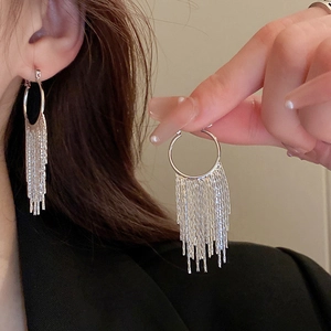 Silver metallic hoop earrings with long twisted fringe tassels for elegant style