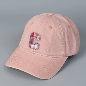 Detail of pink cotton baseball cap featuring checkered C letter embroidery and air vents