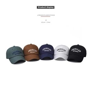 Group display of five embroidered cotton baseball caps in navy, green, black, white, and brown