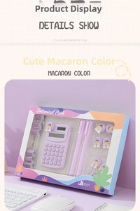 Close-up of macaron purple stationery set with mini calculator and pens on a grid desk