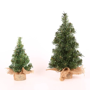 Two 20cm mini artificial Christmas trees with green pine needles and burlap base