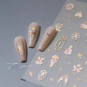 Detailed view of 3D gold embossed nail stickers with baroque crown and star patterns