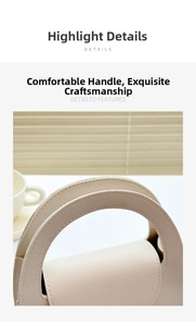 Detail of elegant beige pebbled leather handbag with curved handle and fine stitching