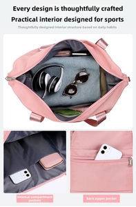 Close-up of internal layered pockets and back zipper pocket of a pink travel sports bag
