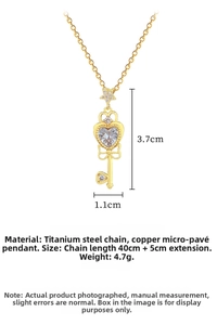 Detailed size view of gold heart key necklace with zircon inlay and star pendant