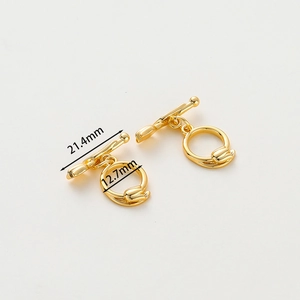 Macro detail of 14k gold-plated toggle clasp with size specs for DIY jewelry making