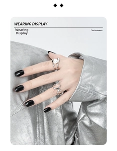 Detail of minimalist S925 sterling silver hollow geometric rings on model hand