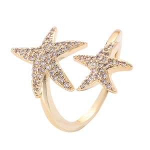 Adjustable gold starfish ring featuring white cubic zirconia in a hip hop design