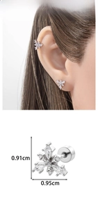 Detail view of silver snowflake earrings with micro-set zircon and size dimensions