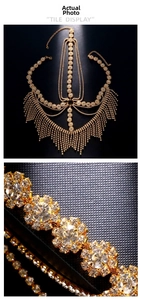 Macro view of gold fringe mask with sparkling rhinestones and detailed metal craftsmanship