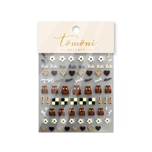 5D embossed nail art stickers with brown bear, flowers and checkered patterns on white background