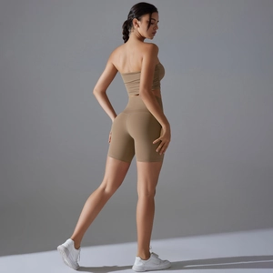 Detailed back view of khaki seamless yoga set featuring ruched tube top and biker shorts