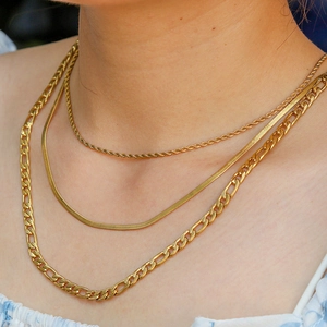 Three-layer gold stainless steel necklace set with cuban, snake, and twisted chains