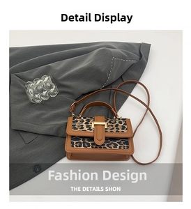 Close-up of leopard print panel and metal buckle detail on the vintage crossbody bag