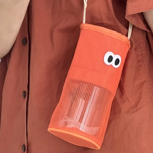 Close-up of orange mesh water bottle bag featuring cute cartoon eyes and drawstring strap