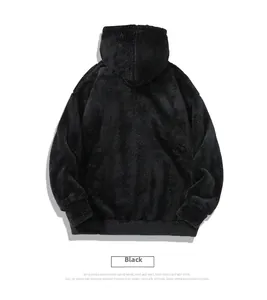 Detail view of the black oversized plush fleece hoodie with soft textured sherpa fabric