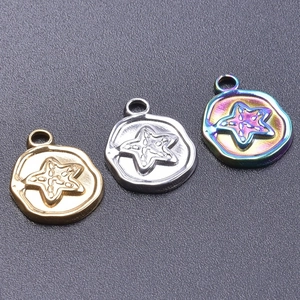 Detailed view of starfish embossed pendants in gold, silver and rainbow plated steel