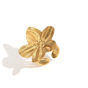 Detailed close-up of golden 3D flower ring with adjustable band on white background