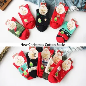 Detailed view of festive Christmas cotton socks set with santa and reindeer patterns