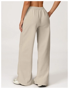 Detail view of high waist wide leg joggers in beige fleece with elastic waistband back