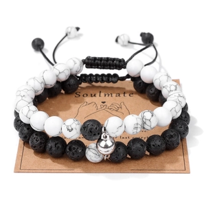 Lava stone and white turquoise magnetic couple bracelets on a Soulmate card