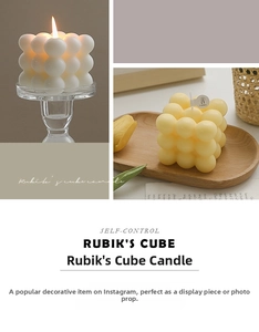Detailed view of white and cream cube bubble candles in a minimalist Nordic home setting