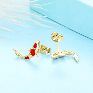 Detail of koi fish stud earrings with red enamel inlay and sparkling zircon eyes