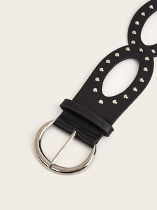 Detail of black PU leather belt with silver hollow metal buckle and rivet embellishments