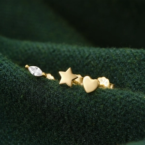 Close-up of S925 sterling silver studs with heart, star, and marquise zircon details