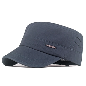Close-up of a dark grey cotton cadet cap featuring a vintage metal logo and fine stitching
