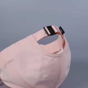 Rear view of a pink satin baseball cap featuring an adjustable black buckle strap