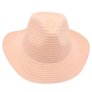 Close-up of peach pink knitted fedora showing detailed crochet spiral texture and wavy brim