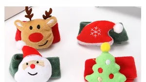 Detail of plush Christmas slap bracelets with reindeer, Santa, and tree designs