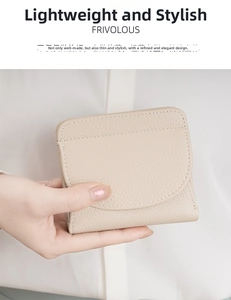 Close-up of beige leather short wallet with pebble grain texture and stitching details