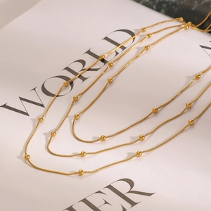 Elegant multi-layered gold bead necklace in stainless steel with polished round beads