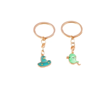 Halloween cartoon keychain set featuring a teal witch hat and light green ghost charm