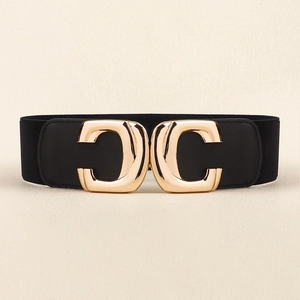 Detail of wide elastic waist belt with large gold double-C buckle on black leather strap