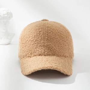 Detailed texture of khaki sherpa baseball cap on a minimalist artistic background