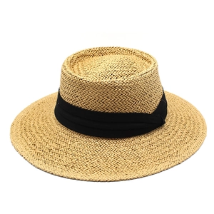 Close-up of the boater hat showing detailed woven texture and wide black ribbon trim