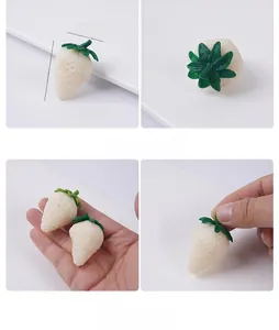 Detailed view of white artificial strawberry model showing 4.6cm by 3.3cm dimensions