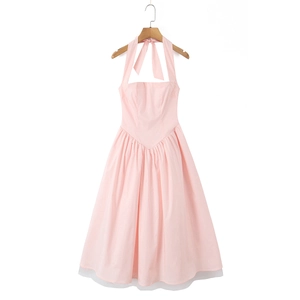 Pink halter neck maxi dress with cinched waist and pleated retro skirt on white background
