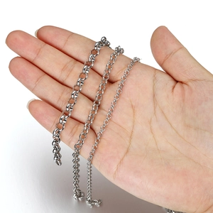 Comparison of three widths of bright silver O-link chains held by hand for DIY jewelry