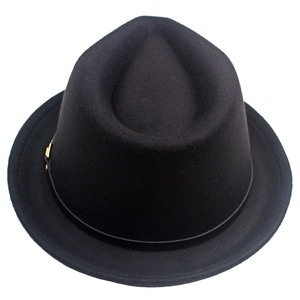 Detail shot of black wool fedora hat with elegant gold buckle and matching band