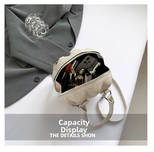 Top view of star-shaped crossbody bag interior showing phone and cosmetics capacity
