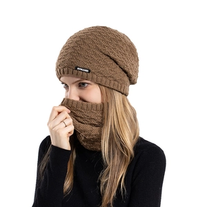 Winter knit beanie and neck warmer set in brown with textured wave pattern and brand label