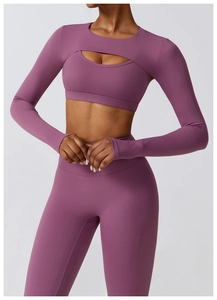 Detail of burgundy cutout yoga top and high-waist leggings in matte stretch fabric