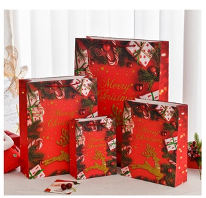Set of 4 oversized red Christmas gift bags with gold foil and glitter reindeer motifs