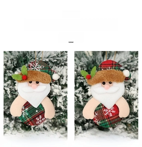 Detail of Santa plush ornament with red plaid fabric and 6.2g weight on Christmas tree