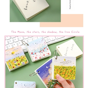 Detail of oil painting style flashcards with iron ring binding on a desk background