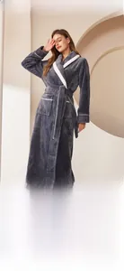 Close-up of thick dark grey flannel bathrobe showing luxury pineapple grid texture and belt